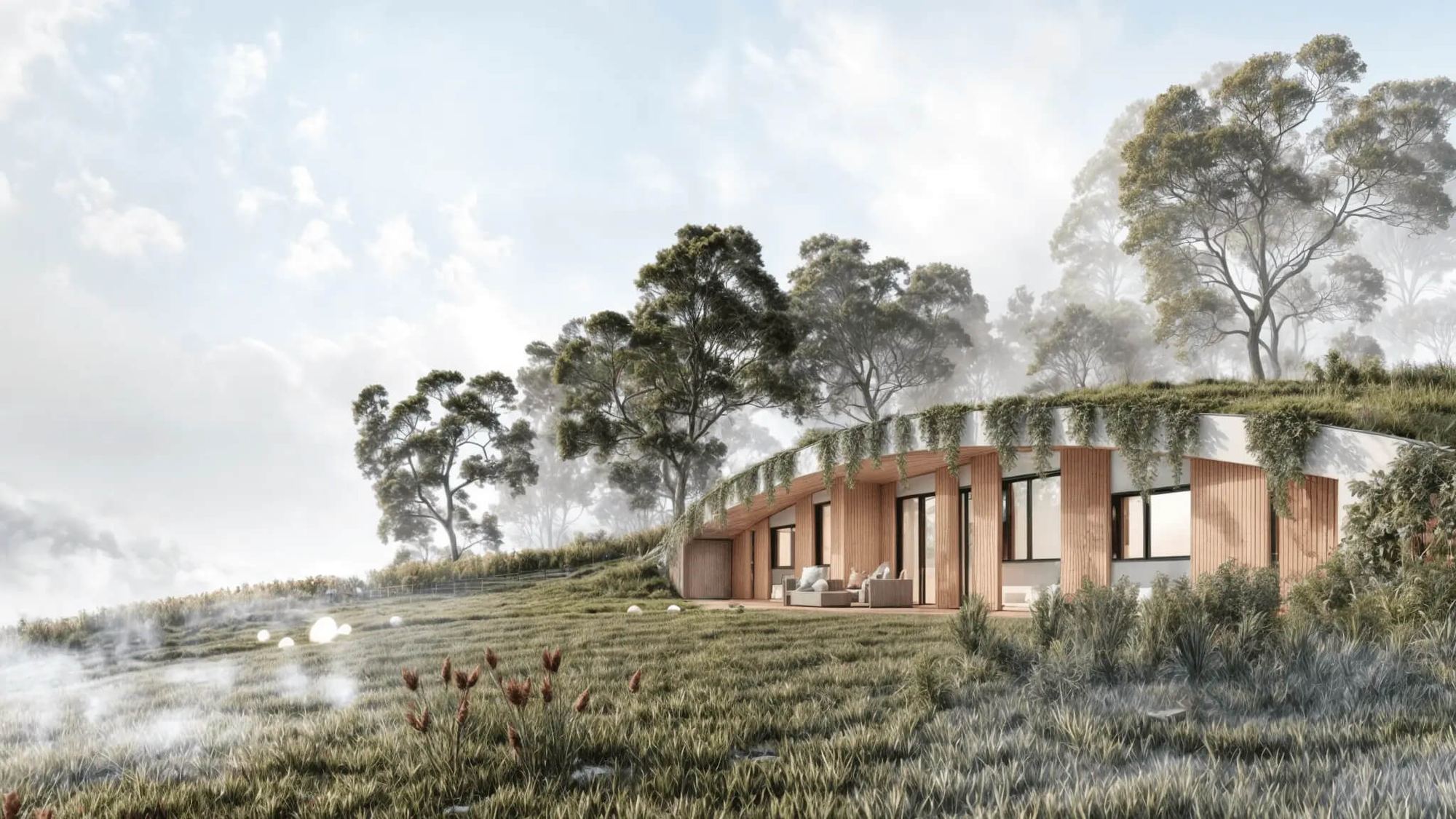 Casa interrata Bublina nella nebbia mattutina, tetto verde che si fonde col prato, facciata vetrata e terrazza in legno